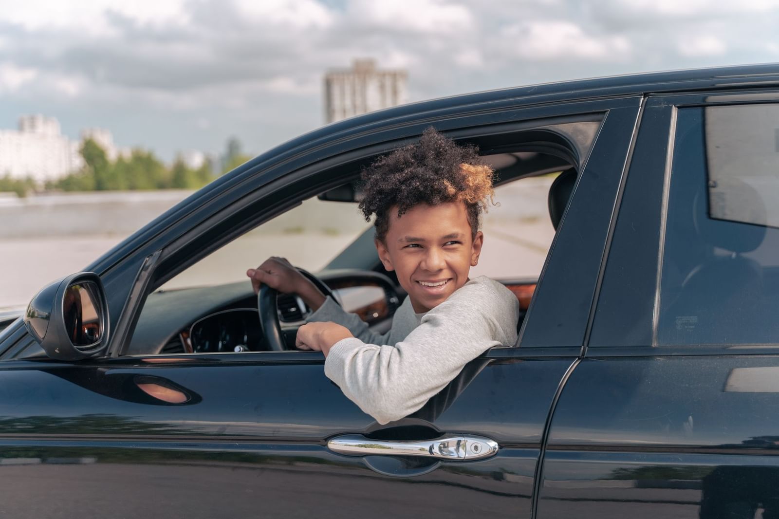 A learner sitting easy in the car after a lesson that went well